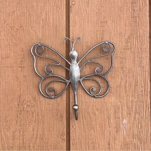Cute metal butterfly wall art and hanger.